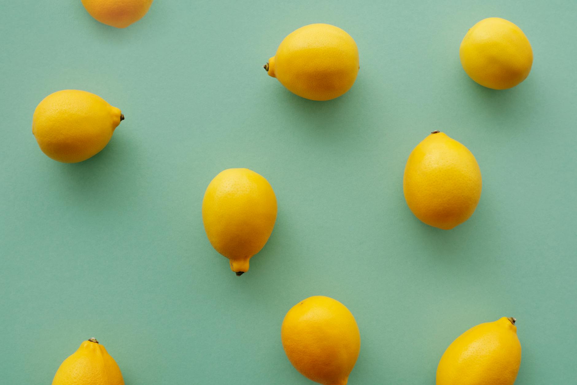 Fresh yellow lemons on a pastel background, symbolizing renewal and sensitivity restoration